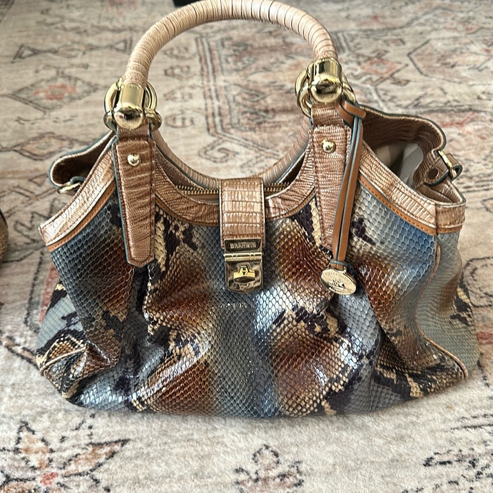 Brahmin purse no strap and minor wear on corner of purse as pictured.